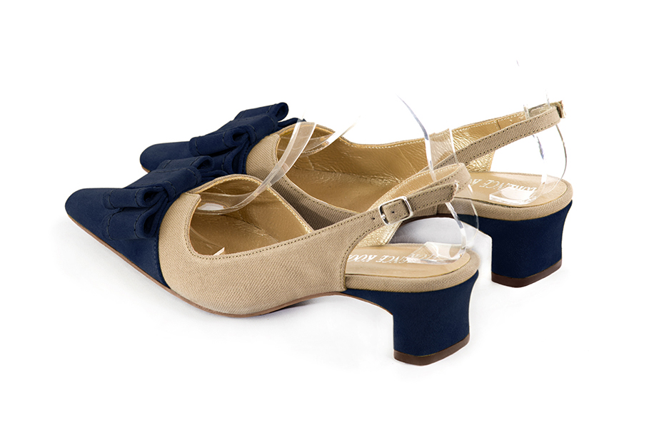 French elegance and refinement for these navy blue and tan beige dress slingback shoes, with a knot, 
                available in many subtle leather and colour combinations. The pretty French spirit of this beautiful pump will accompany your steps nicely and comfortably.
To be personalized or not, with your materials and colors.  
                Matching clutches for parties, ceremonies and weddings.   
                You can customize these shoes to perfectly match your tastes or needs, and have a unique model.  
                Choice of leathers, colours, knots and heels. 
                Wide range of materials and shades carefully chosen.  
                Rich collection of flat, low, mid and high heels.  
                Small and large shoe sizes - Florence KOOIJMAN